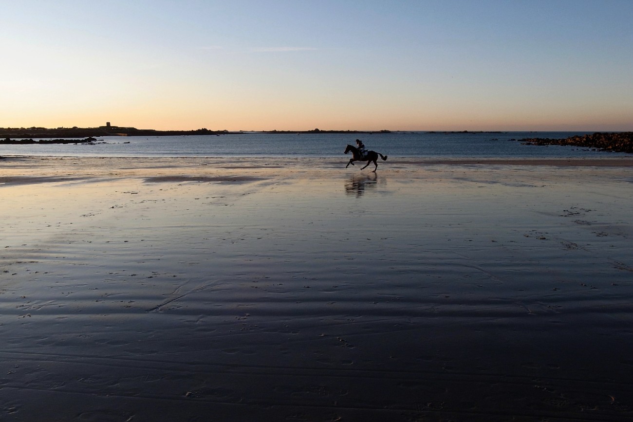 Horse riding in Guernsey at dusk